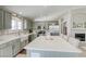 Stylish kitchen with a white marble center island, stainless appliances and farmhouse sink at 6021 Winter Meadow St, Las Vegas, NV 89130