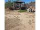 Tranquil backyard with a swing set and garden area, offering outdoor relaxation and enjoyment at 626 Kimberly Ave, Pahrump, NV 89060