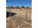 Spacious backyard, enclosed with chain-link fencing, offering privacy and security at 626 Kimberly Ave, Pahrump, NV 89060