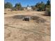 Open backyard space, ready for landscaping, with a shed in the background at 626 Kimberly Ave, Pahrump, NV 89060