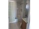 Bright bathroom with a shower-tub combination, single sink vanity, and updated shower head at 626 Kimberly Ave, Pahrump, NV 89060