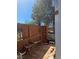 Outdoor deck area with a wood bench and fencing at 626 Kimberly Ave, Pahrump, NV 89060