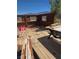 Outdoor deck area with scattered items and mountain view at 626 Kimberly Ave, Pahrump, NV 89060