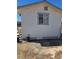 Exterior view of home showing window, utility connections and landscape elements at 626 Kimberly Ave, Pahrump, NV 89060