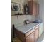 Laundry room with wooden cabinets and a countertop at 626 Kimberly Ave, Pahrump, NV 89060