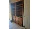 Living room with built-in wooden shelving at 626 Kimberly Ave, Pahrump, NV 89060