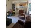 Living room featuring tiled floor, armchairs, and dining area at 626 Kimberly Ave, Pahrump, NV 89060