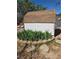 Storage shed surrounded by flower beds and lush greenery at 626 Kimberly Ave, Pahrump, NV 89060