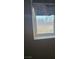 A window covered with insulation, offering natural light into room with outdoor scenery at 626 Kimberly Ave, Pahrump, NV 89060
