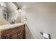 Half bath with a stylish granite countertop and updated vanity at 6312 Snap Ridge St # 101, North Las Vegas, NV 89081