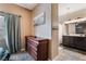 Bedroom hallway leading to the en suite bathroom with double sinks at 6312 Snap Ridge St # 101, North Las Vegas, NV 89081