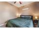 Spacious bedroom with natural light, bedside tables and plush carpet at 6312 Snap Ridge St # 101, North Las Vegas, NV 89081
