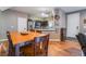Cozy dining area adjacent to the kitchen with natural wood floors at 6312 Snap Ridge St # 101, North Las Vegas, NV 89081