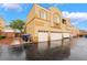 Townhouse complex features a stucco exterior, attached garages, and well-maintained landscaping at 6312 Snap Ridge St # 101, North Las Vegas, NV 89081