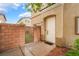 Charming front entrance with a private gated courtyard and well-manicured landscaping at 6312 Snap Ridge St # 101, North Las Vegas, NV 89081