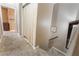 Upstairs hallway leading to bedrooms, featuring carpet and railing at 6312 Snap Ridge St # 101, North Las Vegas, NV 89081