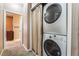 Efficient laundry area featuring stacked washer and dryer units, maximizing space at 6312 Snap Ridge St # 101, North Las Vegas, NV 89081