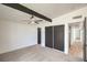 Bright bedroom featuring a ceiling fan, and a spacious closet with sleek sliding doors at 6320 Dayton Ave, Las Vegas, NV 89107