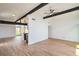 Spacious, light-filled living area with laminate flooring and contemporary design elements at 6320 Dayton Ave, Las Vegas, NV 89107
