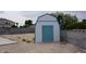 Backyard featuring a white and blue shed with block wall fencing on a leveled lot at 6432 Jean Lee Dr, Las Vegas, NV 89108