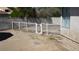 Backyard dog run with gate and gravel, offering a secure and contained outdoor pet area at 6432 Jean Lee Dr, Las Vegas, NV 89108