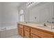 Bathroom with a bathtub and double sink vanity with great counter space at 6432 Jean Lee Dr, Las Vegas, NV 89108