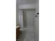 Bright bathroom featuring a shower and white tiled flooring at 6432 Jean Lee Dr, Las Vegas, NV 89108