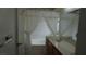 Bathroom featuring a shower-tub combo and a single sink at 6432 Jean Lee Dr, Las Vegas, NV 89108