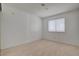 An open and spacious bedroom featuring neutral colors and a light-filled window at 6432 Jean Lee Dr, Las Vegas, NV 89108