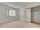Neutral bedroom with large mirrored closet and light-filled window at 6432 Jean Lee Dr, Las Vegas, NV 89108
