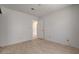 This bedroom features neutral walls, tile floors, and a doorway that leads to another room at 6432 Jean Lee Dr, Las Vegas, NV 89108