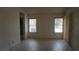 Spacious room with two windows and tile flooring at 6432 Jean Lee Dr, Las Vegas, NV 89108