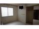 Comfortable bedroom with hardwood floors and a large window at 6432 Jean Lee Dr, Las Vegas, NV 89108