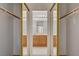 Walk-in closet with mirrored doors showcasing the bathroom at the end of the hall at 6432 Jean Lee Dr, Las Vegas, NV 89108