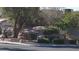 A landscaped sign for Sterling Springs Homeowners Association with lush green plants at 6432 Jean Lee Dr, Las Vegas, NV 89108