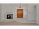 Open foyer features a fireplace, double-door entry, and neutral tones at 6432 Jean Lee Dr, Las Vegas, NV 89108