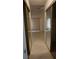 Bright hallway features mirrored closet doors, leading into a sunlit room with neutral tile floors at 6432 Jean Lee Dr, Las Vegas, NV 89108