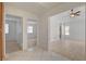 Hallway showing access to bedrooms and living room, with neutral tile and wood flooring at 6432 Jean Lee Dr, Las Vegas, NV 89108