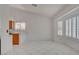 Kitchen and breakfast nook with tile floors and views of the front yard at 6432 Jean Lee Dr, Las Vegas, NV 89108