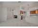 Open-concept kitchen and dining area featuring tile floors and a fireplace at 6432 Jean Lee Dr, Las Vegas, NV 89108