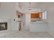 Open kitchen with wood cabinets, modern appliances, and adjacent living area at 6432 Jean Lee Dr, Las Vegas, NV 89108