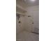 Functional laundry room boasts tiled floor, built-in shelving, and access to the exterior door at 6432 Jean Lee Dr, Las Vegas, NV 89108
