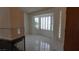 Living room with tile floors, shuttered windows and room for dining at 6432 Jean Lee Dr, Las Vegas, NV 89108