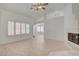 Spacious living room with fireplace, shutters, and abundant natural light at 6432 Jean Lee Dr, Las Vegas, NV 89108