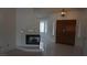 Welcoming living room featuring a fireplace and bright, tiled floors, and a front door at 6432 Jean Lee Dr, Las Vegas, NV 89108