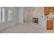 Bright living space with fireplace, plantation shutters, and kitchen view at 6432 Jean Lee Dr, Las Vegas, NV 89108