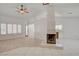 Open living space with fireplace and views to the kitchen at 6432 Jean Lee Dr, Las Vegas, NV 89108