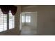 View of the open living room with tile floors and shuttered windows at 6432 Jean Lee Dr, Las Vegas, NV 89108