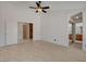 Spacious main bedroom with modern ceiling fan, and an ensuite bath at 6432 Jean Lee Dr, Las Vegas, NV 89108