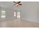 Spacious main bedroom with a glass sliding door leading to the patio at 6432 Jean Lee Dr, Las Vegas, NV 89108